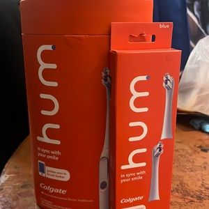 New in packaging Hum Colgate travel case and one hand and three brush head
